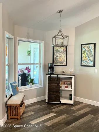 a view of a livingroom with furniture and window