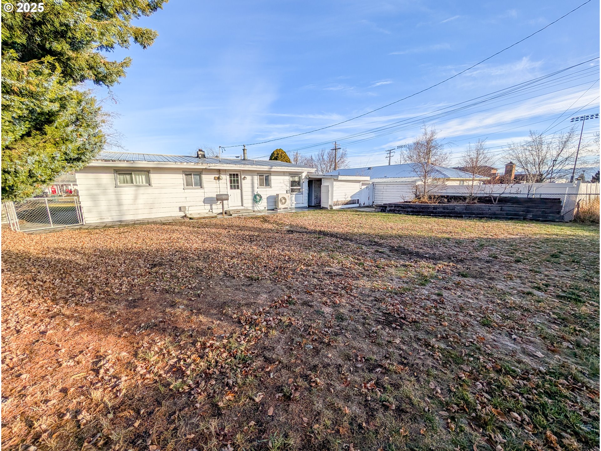 1106 F Avenue La Grande, OR 97850 - Photo 15 of 18 a view of a house with backyard and sitting area