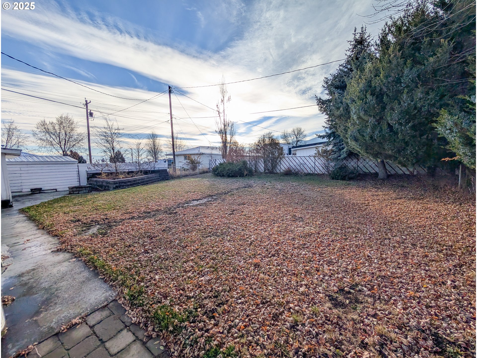 1106 F Avenue La Grande, OR 97850 - Photo 16 of 18 a view of a dry yard with wooden fence