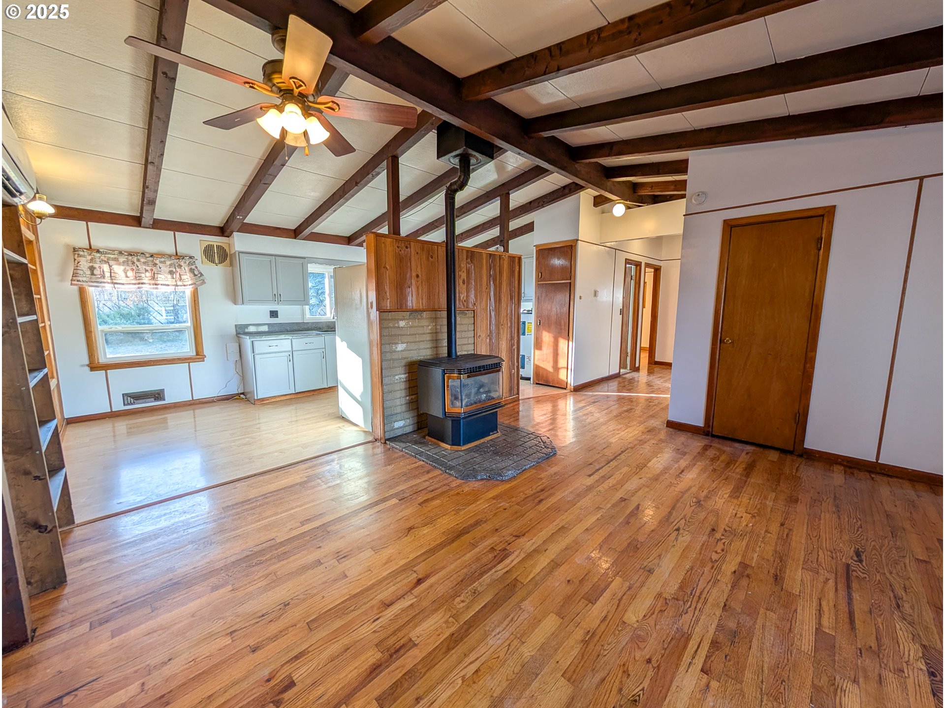 1106 F Avenue La Grande, OR 97850 - Photo 2 of 18 a view of empty room with wooden floor