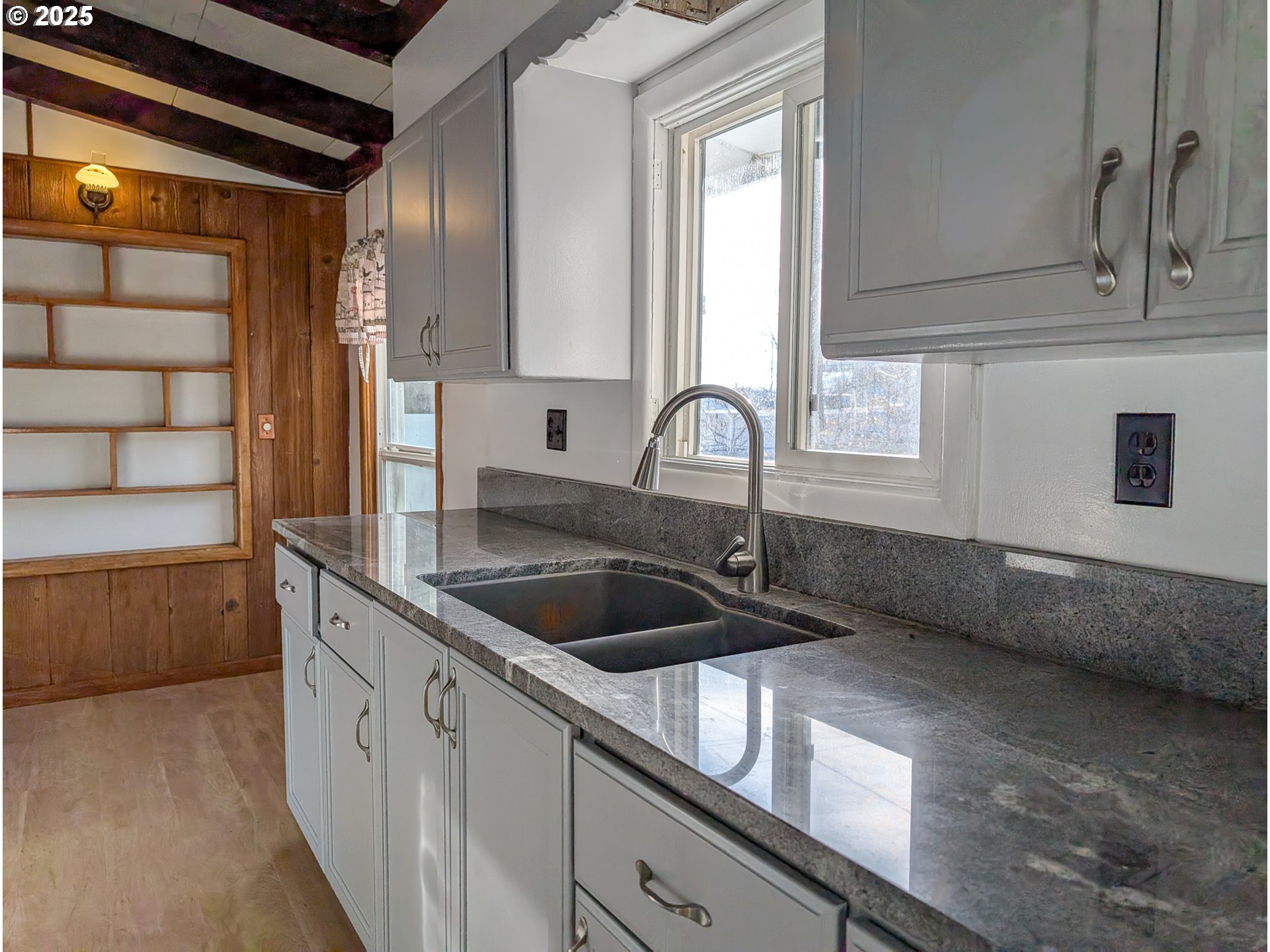 1106 F Avenue La Grande, OR 97850 - Photo 6 of 18 a kitchen with a sink and cabinets