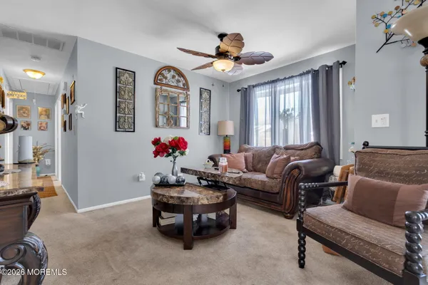 a living room with furniture and window