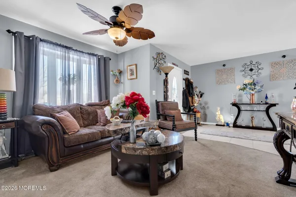 a living room with furniture and a large window