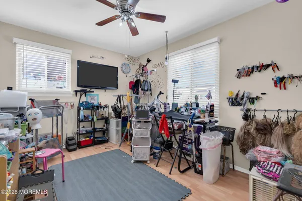 a living room filled with furniture and a flat screen tv
