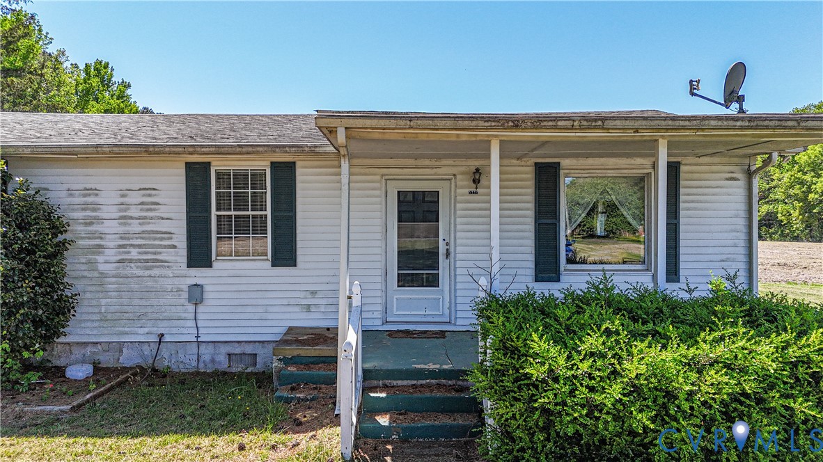 5134 Beechland Road Elberon, VA 23846 - Photo 2 of 21 front view of a house with a small yard