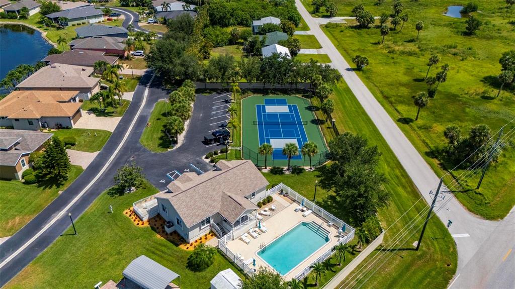 24604 Rio Villa Lakes Circle Punta Gorda, FL 33950 - Photo 21 of 28 an aerial view of a house with a garden and plants