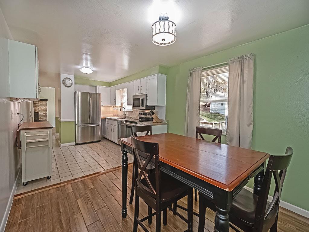 1749 Washington Road Apollo, PA 15613 - Photo 11 of 36 a view of a dining room with furniture and wooden floor