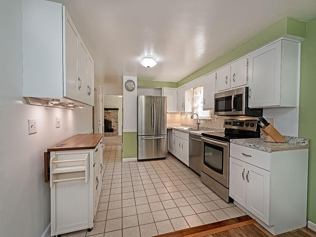 1749 Washington Road Apollo, PA 15613 - Photo 12 of 36 a kitchen with a refrigerator sink and microwave