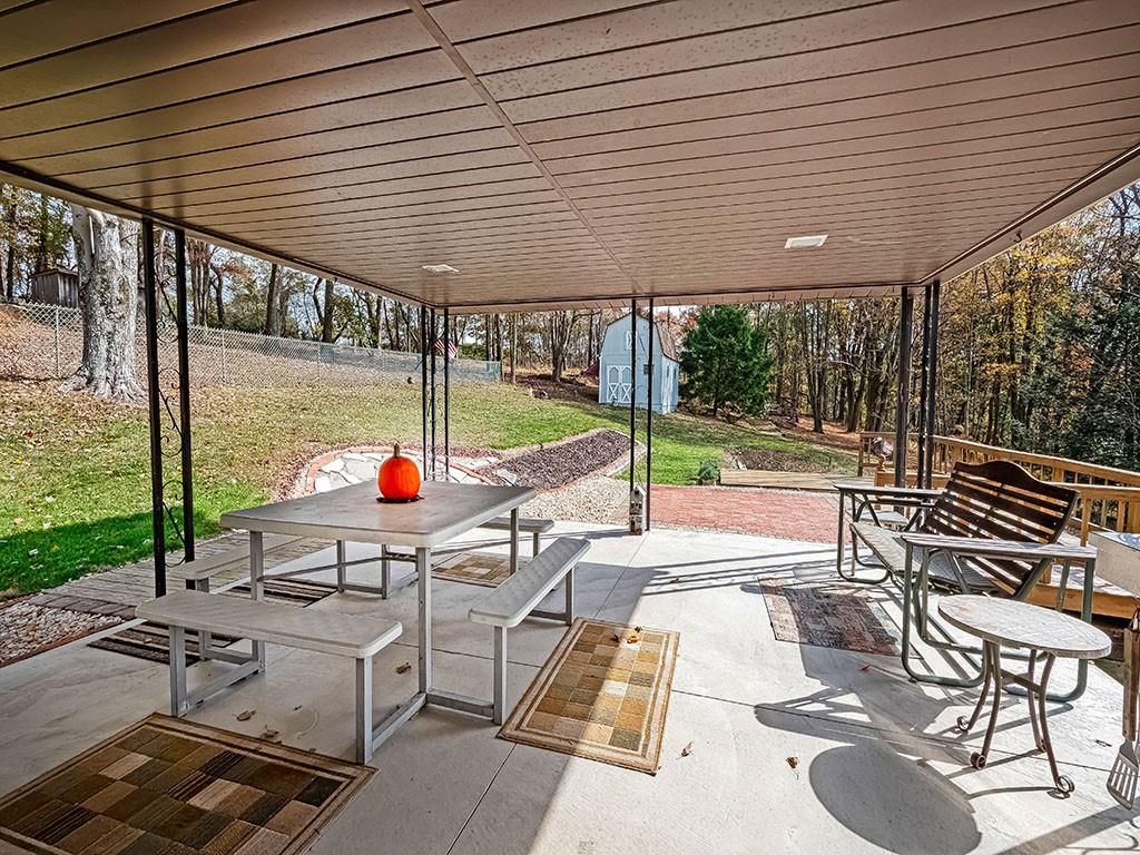 1749 Washington Road Apollo, PA 15613 - Photo 20 of 36 a view of a patio with a table and chairs