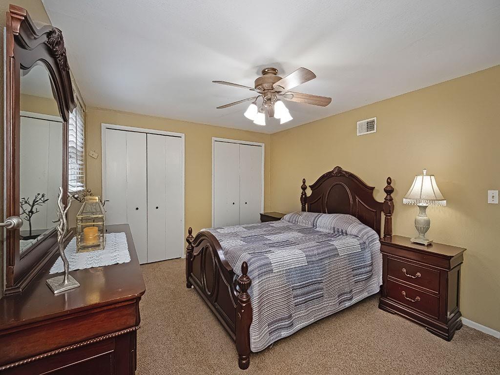 1749 Washington Road Apollo, PA 15613 - Photo 22 of 36 a bedroom with a bed and a chandelier