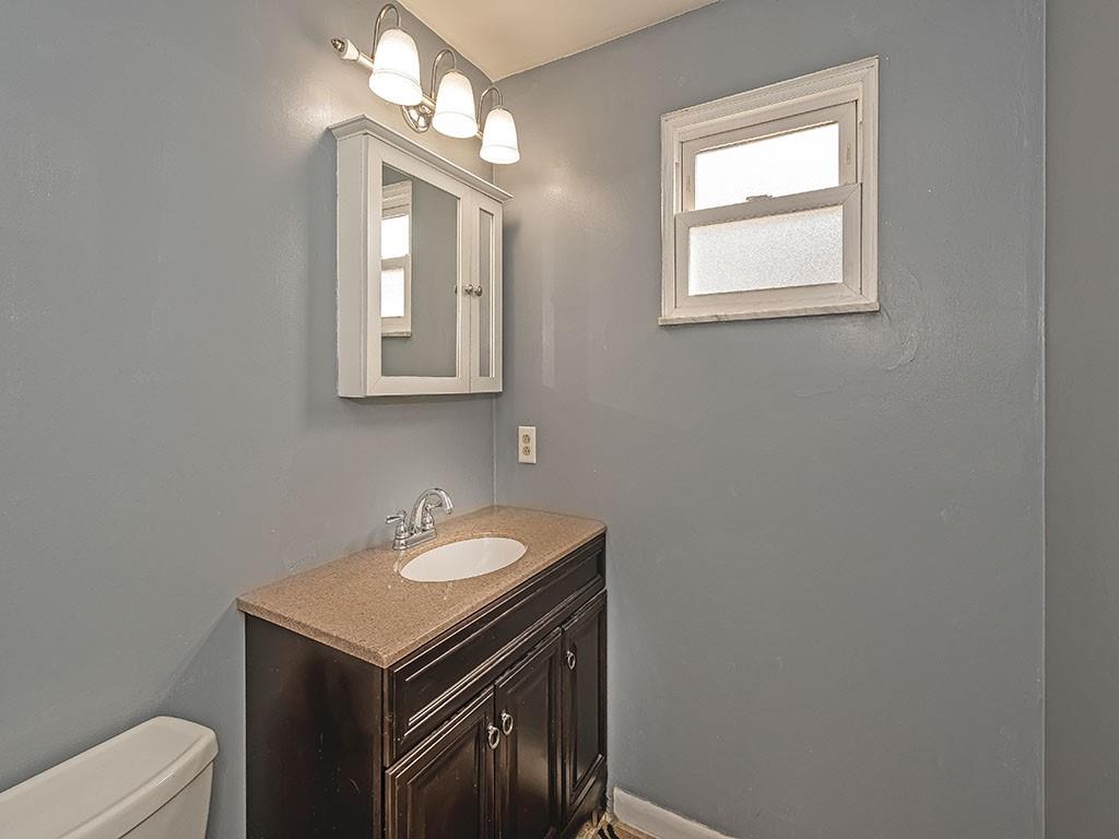 1749 Washington Road Apollo, PA 15613 - Photo 24 of 36 a bathroom with a sink a mirror and a toilet