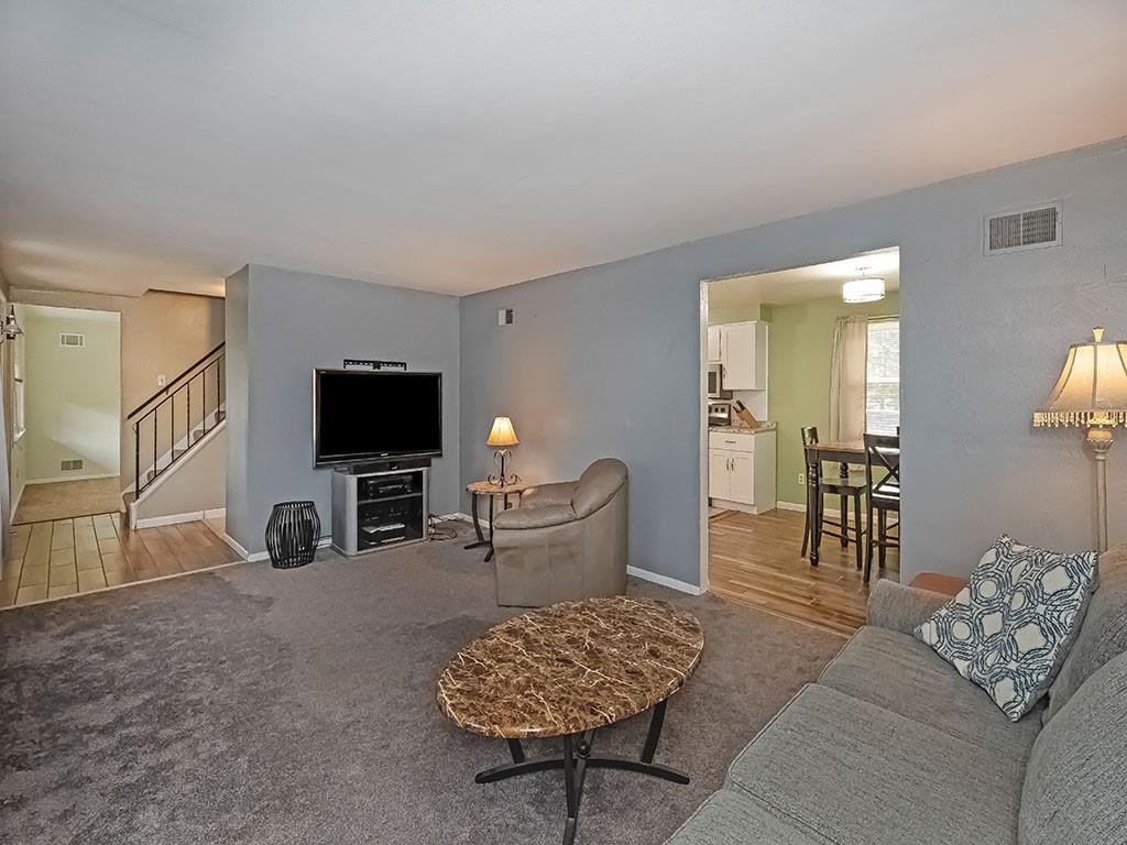 1749 Washington Road Apollo, PA 15613 - Photo 7 of 36 a living room with furniture and a flat screen tv