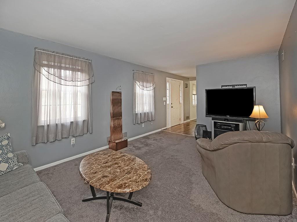 1749 Washington Road Apollo, PA 15613 - Photo 8 of 36 a living room with furniture and a flat screen tv