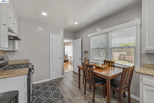 a view of a dining room with furniture window and outside view