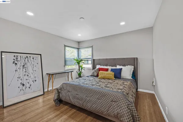 a bedroom with a large bed and a table in it