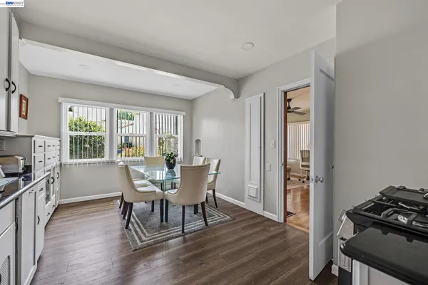 a view of a dining room with furniture window and wooden floor