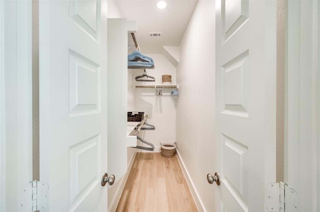 579 Lloyd's Road, Unit 1213A Little Elm, TX 75068 - Photo 16 of 34 a view of a room with wooden floor and staircase
