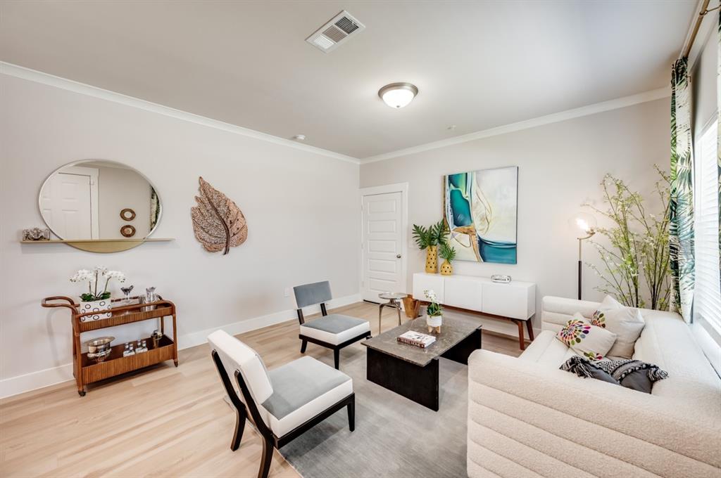 579 Lloyd's Road, Unit 1213A Little Elm, TX 75068 - Photo 6 of 34 a living room with furniture and wooden floor