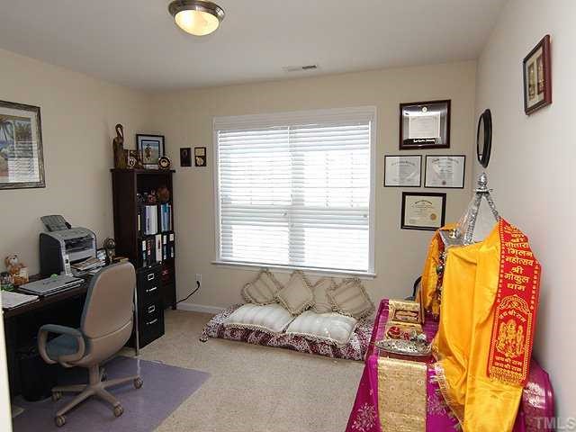 131 Locke Woods Road Raleigh, NC 27603 - Photo 16 of 18 a living room with furniture and a window