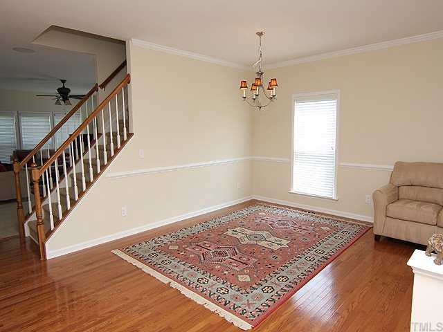 131 Locke Woods Road Raleigh, NC 27603 - Photo 3 of 18 a view of an empty room and wooden floor