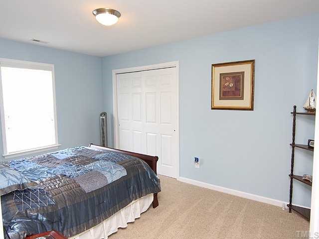 131 Locke Woods Road Raleigh, NC 27603 - Photo 10 of 18 a bedroom with a bed and a window