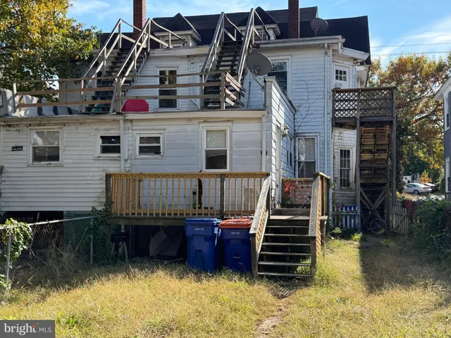 a view of a house with a balcony and door