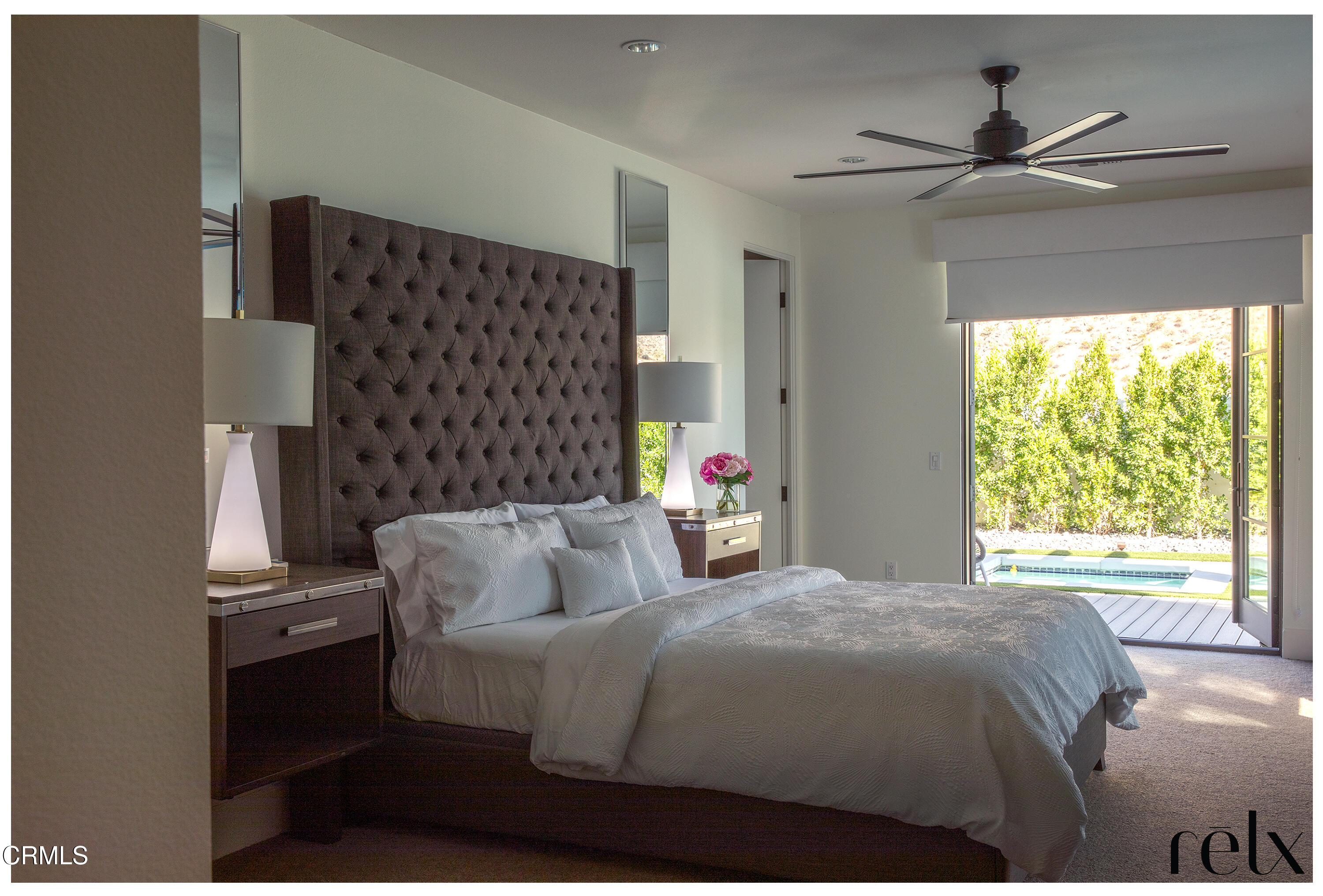 3076 Arroyo Seco Palm Springs, CA 92264 - Photo 12 of 37 a bedroom with a bed and a window