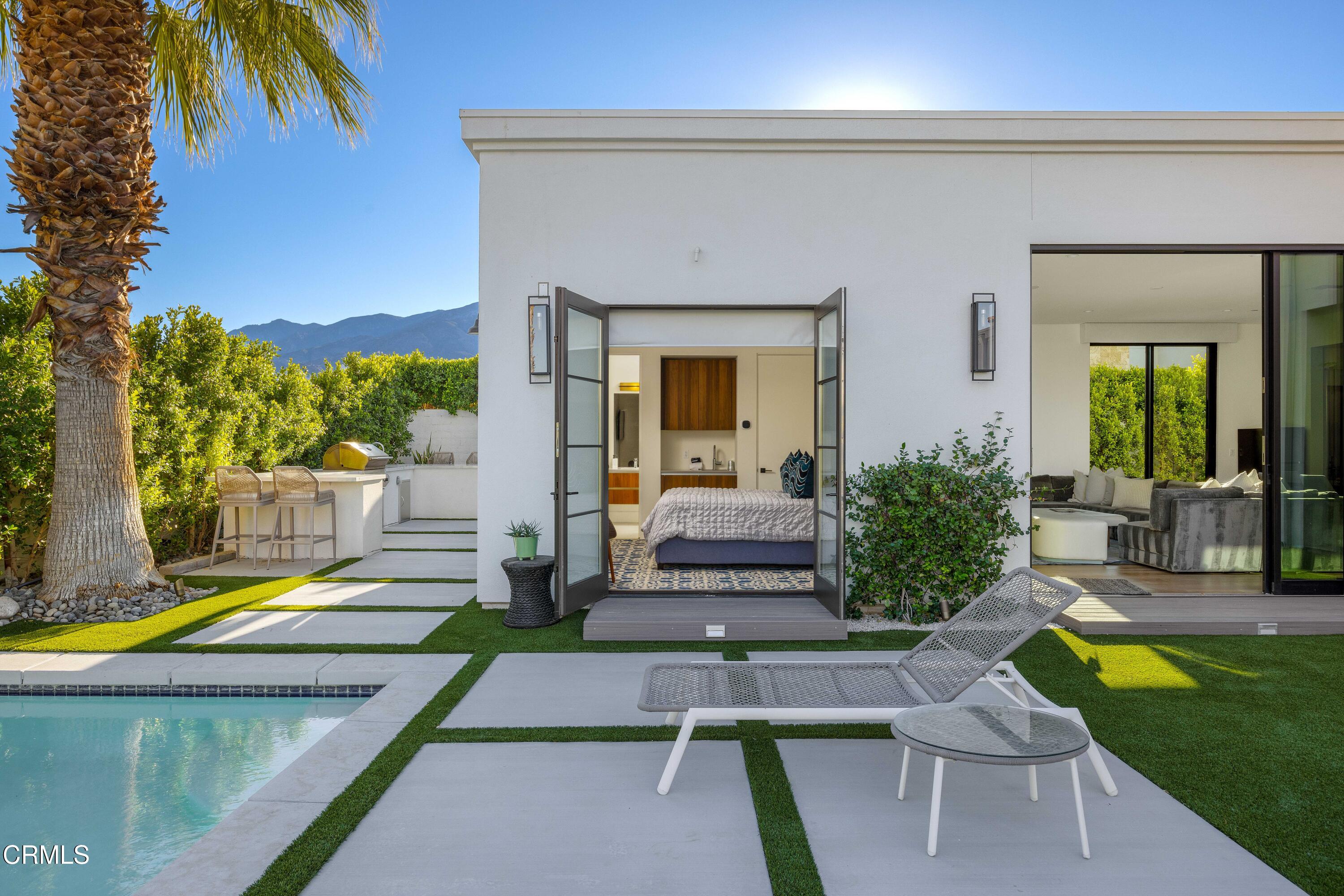 3076 Arroyo Seco Palm Springs, CA 92264 - Photo 14 of 37 a view of a house with swimming pool and sitting area