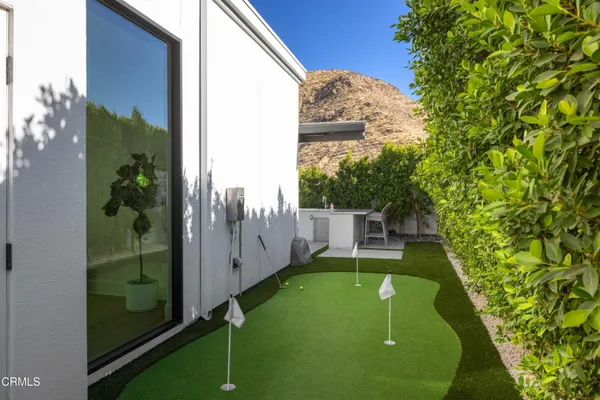 a view of a backyard with swimming pool of house