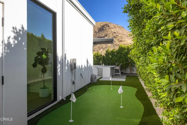 a view of a backyard with swimming pool of house