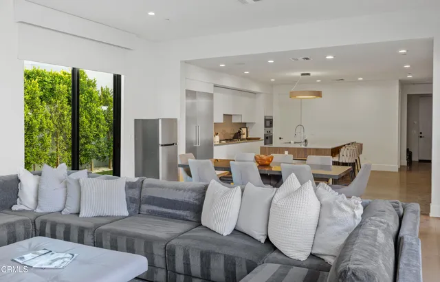 a living room with furniture and a garden