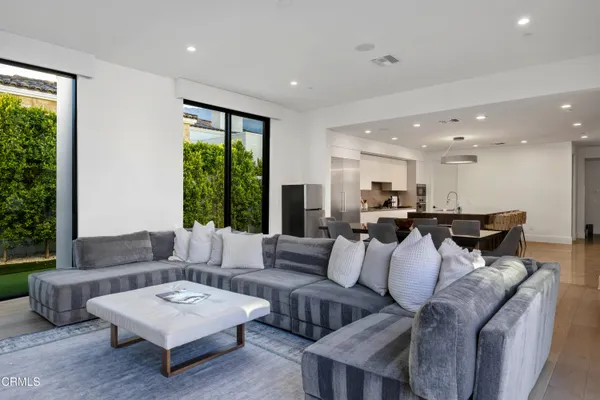 a living room with furniture and a window