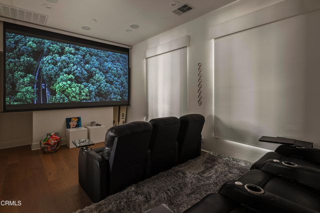 a bedroom with a large bed and a large window