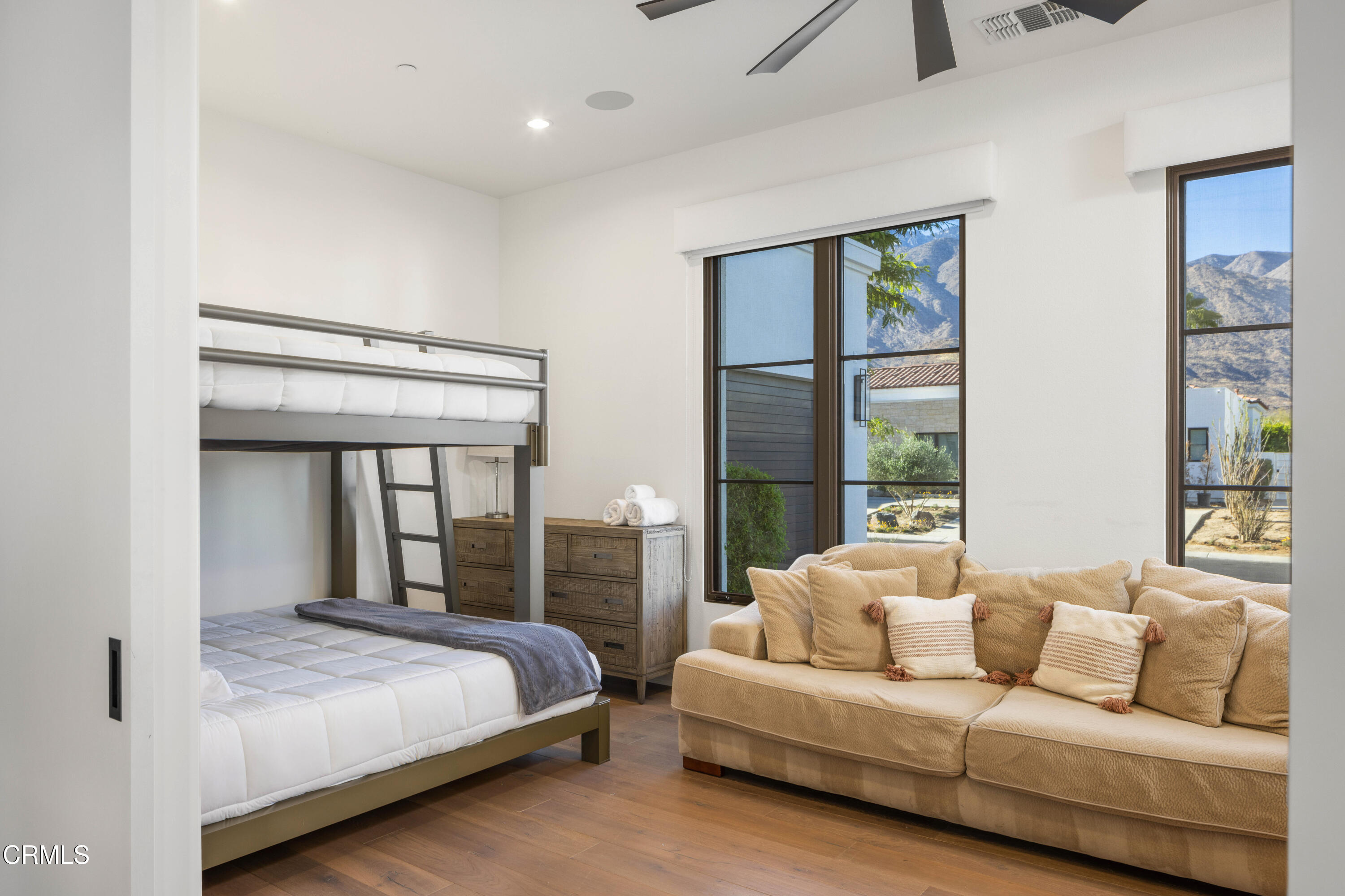 3076 Arroyo Seco Palm Springs, CA 92264 - Photo 25 of 37 a bedroom with a large bed and a large window