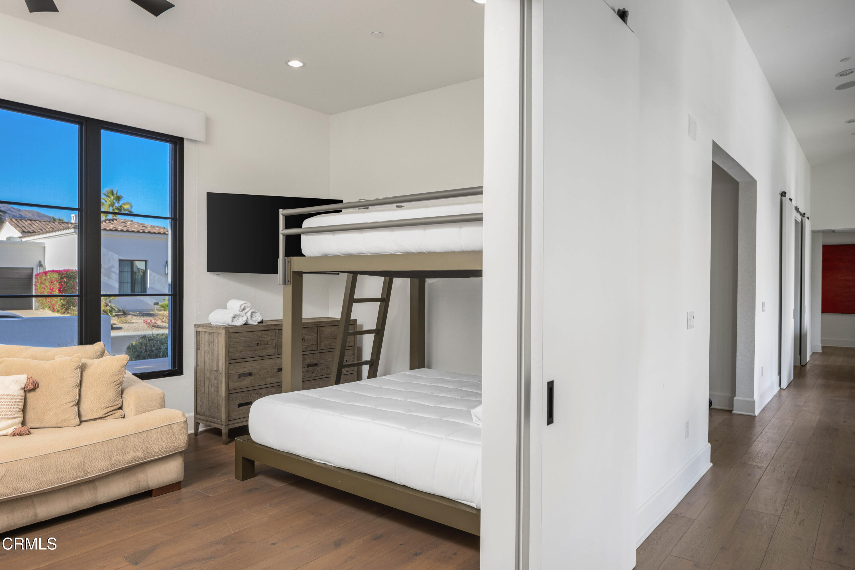 3076 Arroyo Seco Palm Springs, CA 92264 - Photo 26 of 37 a bedroom with a large bed and a balcony view