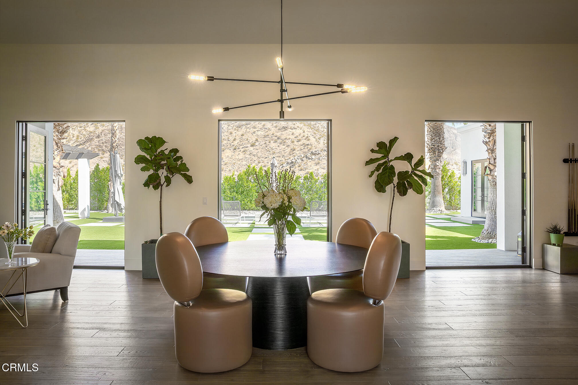 3076 Arroyo Seco Palm Springs, CA 92264 - Photo 32 of 37 a view of a dining room with furniture window and wooden floor