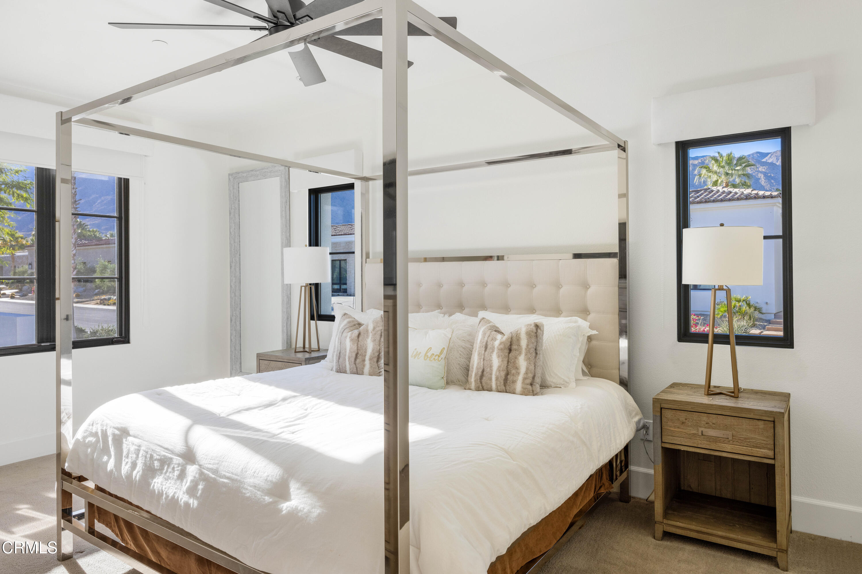 3076 Arroyo Seco Palm Springs, CA 92264 - Photo 34 of 37 a bedroom with a bed and a table