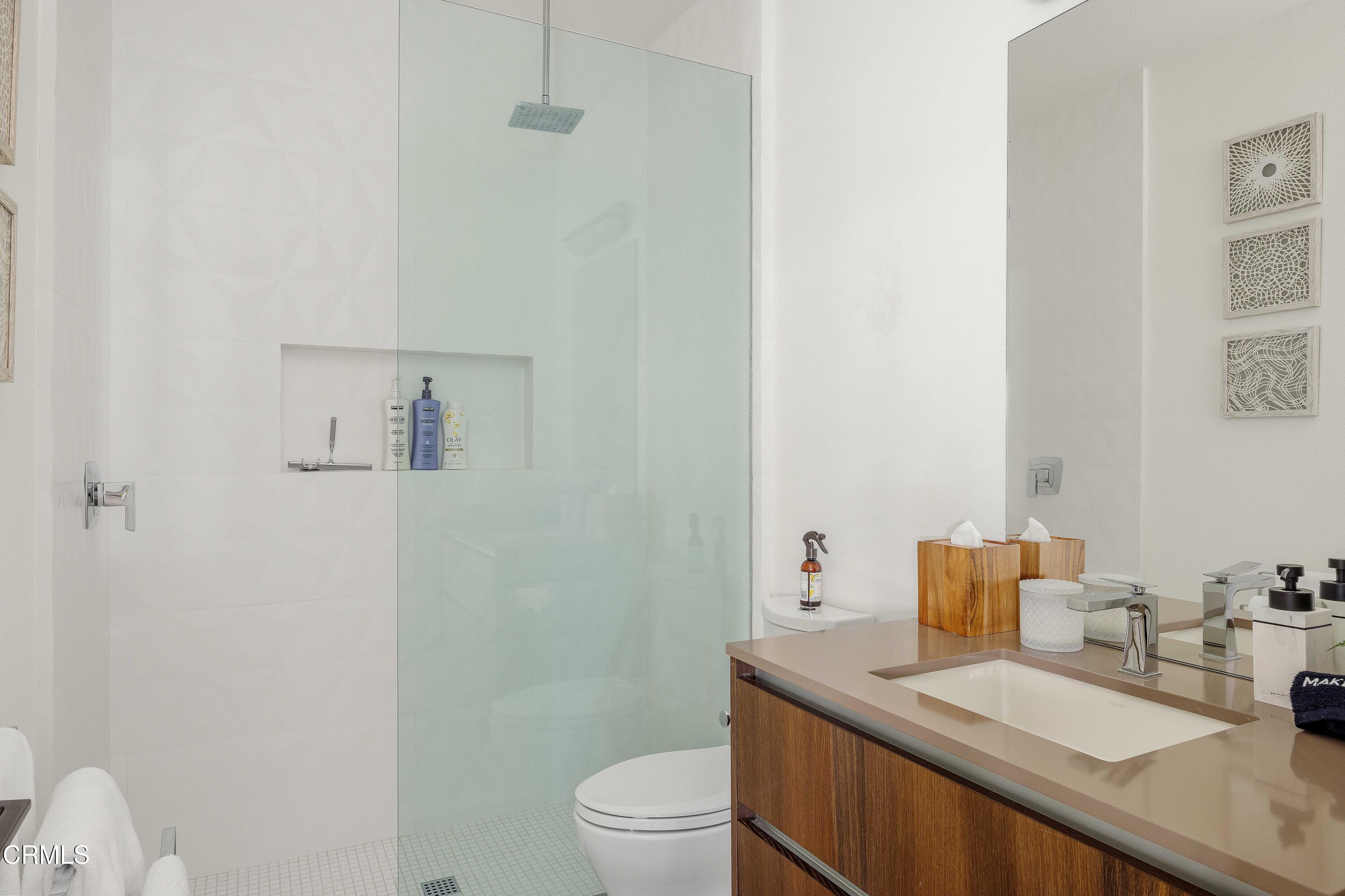 3076 Arroyo Seco Palm Springs, CA 92264 - Photo 37 of 37 a bathroom with a sink a toilet and a mirror