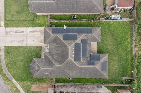 an aerial view of a house with a garden and plants