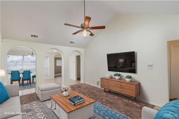 a living room with furniture and a flat screen tv