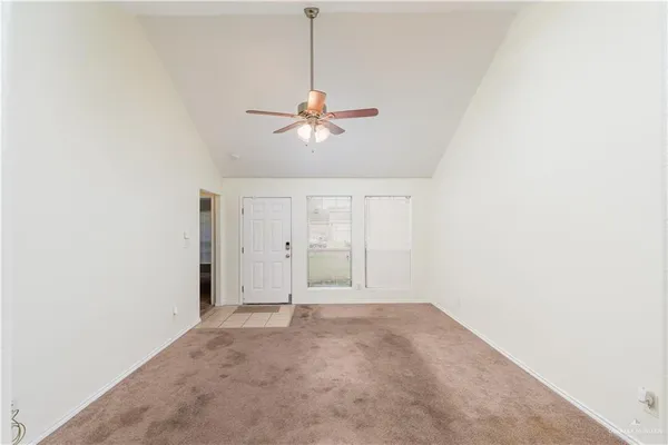 a view of an empty room with a window