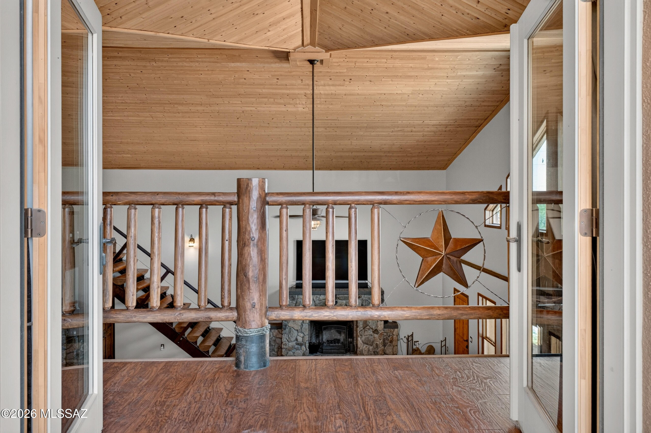531 South Cody Loop Road Oracle, AZ 85623 - Photo 19 of 38 a view of staircase with wooden floor and a window