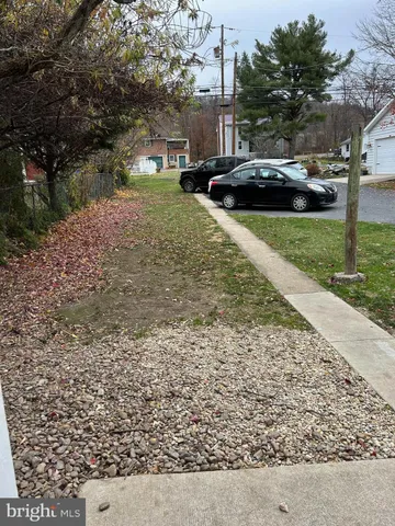 a view of street with parked cars