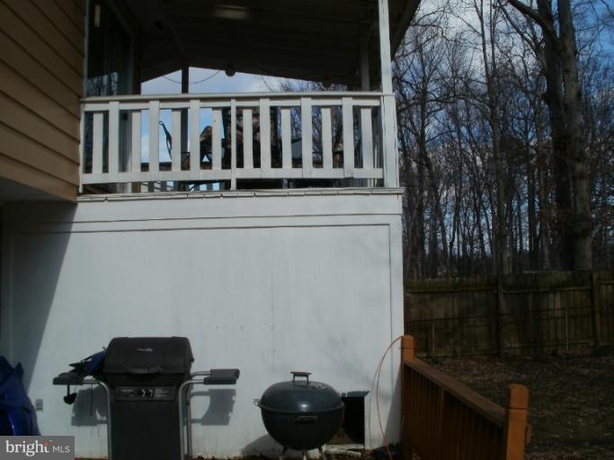 13113 Newgate Road Woodbridge, VA 22193 - Photo 6 of 15 Covered Deck with Below Storage/Platform deck