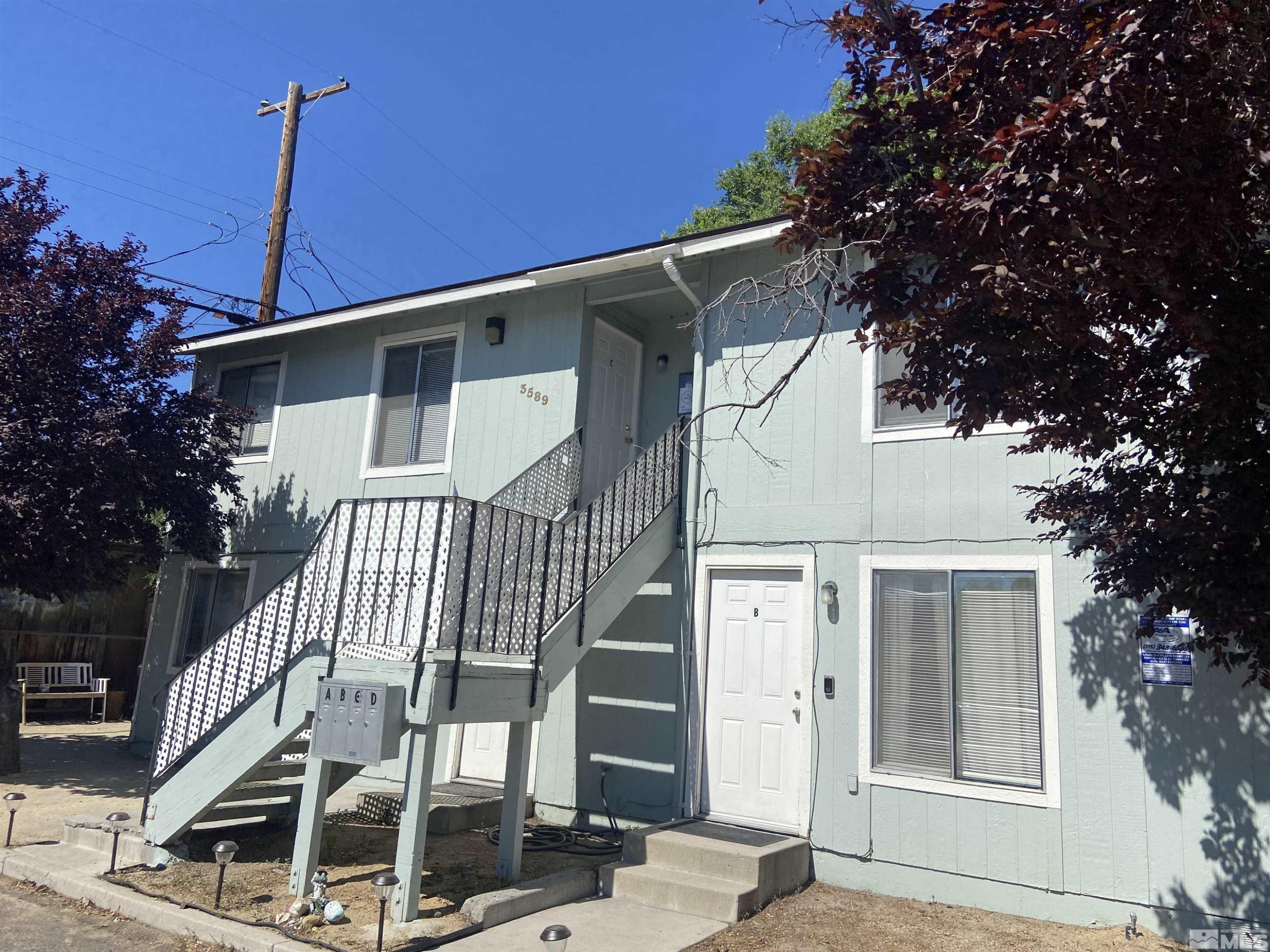 3589 Mazzone Avenue Reno, NV 89502 - Photo 1 of 12 a front view of a house with a yard