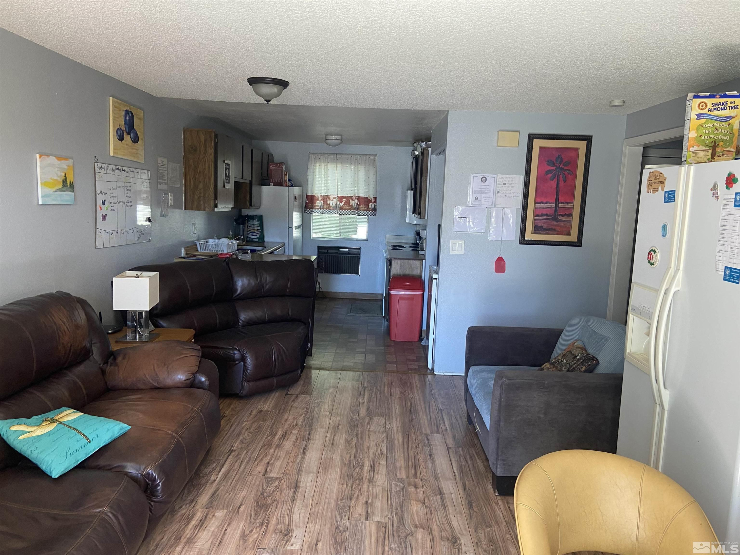 3589 Mazzone Avenue Reno, NV 89502 - Photo 3 of 12 a living room with furniture and a wooden floor