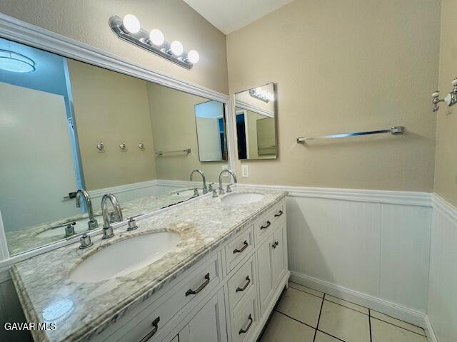 42636 Roadrunner Way Lancaster, CA 93536 - Photo 15 of 19 a bathroom with a granite countertop sink and a mirror