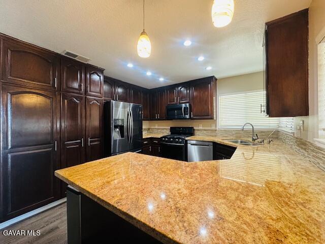 42636 Roadrunner Way Lancaster, CA 93536 - Photo 8 of 19 a kitchen with stainless steel appliances granite countertop a sink a stove and a refrigerator