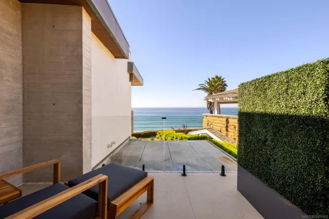 swimming pool view with a seating space