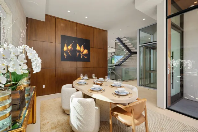 a dining room with furniture and wooden floor